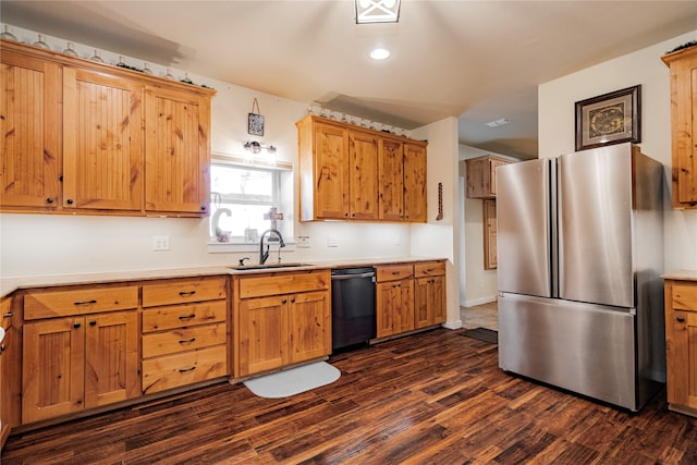 kitchen featuring dark hardwood / wood-style flooring, sink, stainless steel fridge, and dishwasher