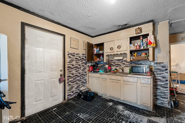 kitchen with sink and a textured ceiling