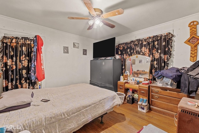 bedroom featuring ceiling fan and wood-type flooring