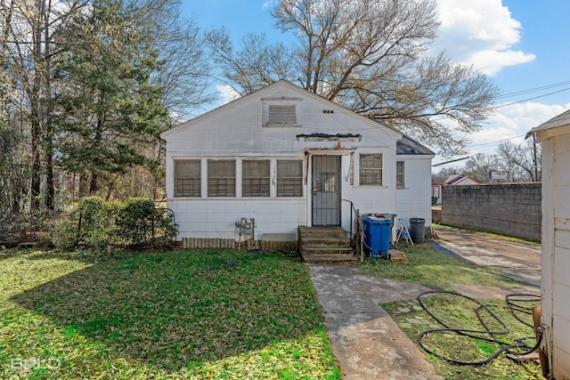 bungalow with a front yard