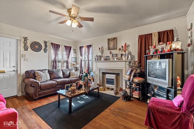 living room featuring hardwood / wood-style floors and ceiling fan