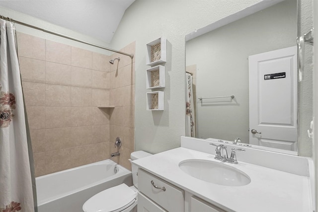 bathroom featuring vaulted ceiling, vanity, shower / bath combo with shower curtain, and toilet