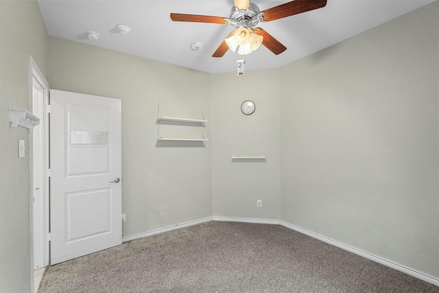 empty room featuring carpet, ceiling fan, and baseboards