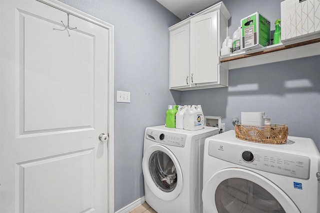 laundry area featuring cabinet space and washer and dryer