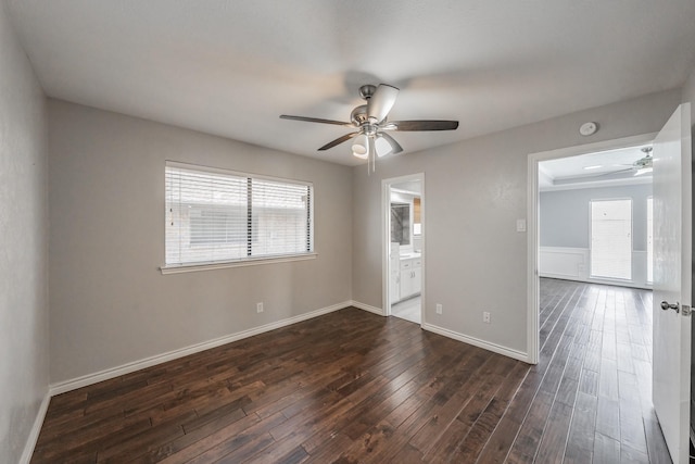 empty room featuring ceiling fan and dark hardwood / wood-style floors