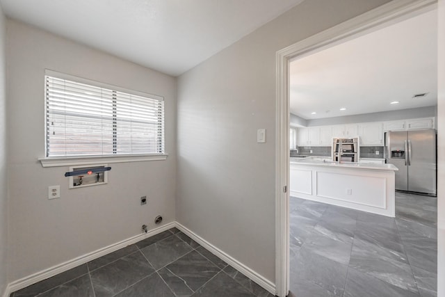 laundry room with electric dryer hookup, hookup for a washing machine, and hookup for a gas dryer