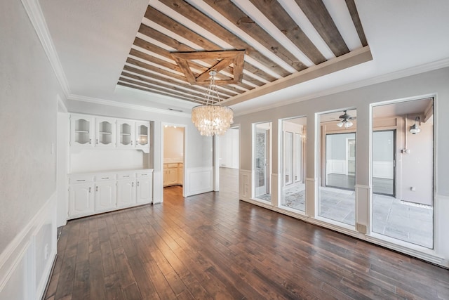 interior space featuring crown molding, dark hardwood / wood-style floors, and a chandelier