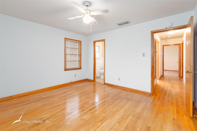 spare room featuring ceiling fan and light wood-type flooring