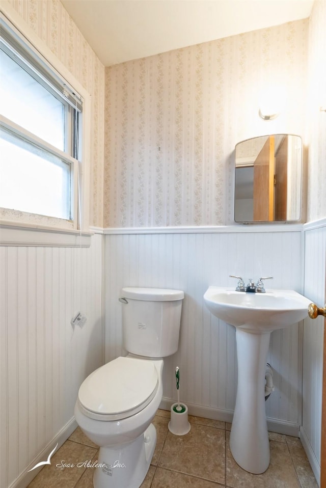 bathroom with tile patterned floors and toilet