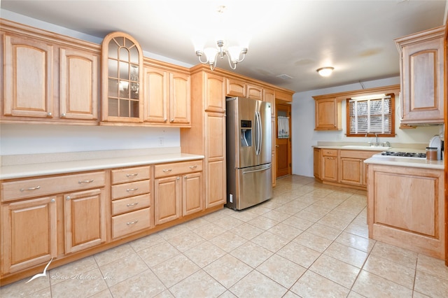 kitchen featuring sink, a chandelier, stainless steel fridge with ice dispenser, light tile patterned floors, and light brown cabinets