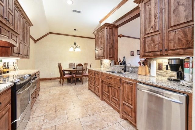 kitchen featuring appliances with stainless steel finishes, pendant lighting, sink, crown molding, and light stone countertops