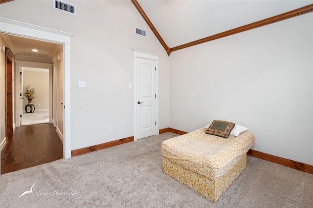 living area with crown molding, carpet floors, and high vaulted ceiling