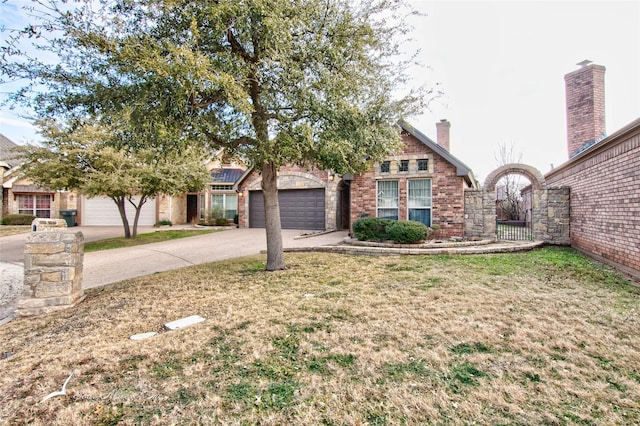 view of front of home featuring a garage and a front lawn