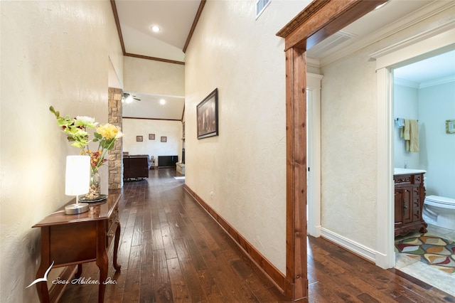 hall featuring crown molding and dark hardwood / wood-style floors