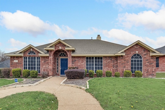 ranch-style house featuring a front lawn