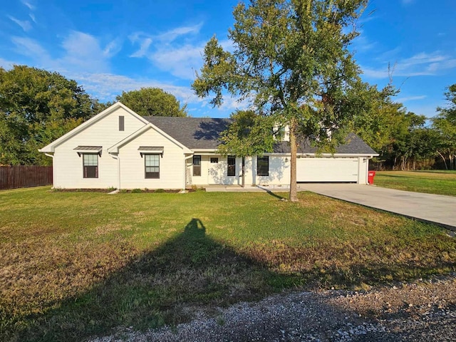 single story home with a garage and a front yard