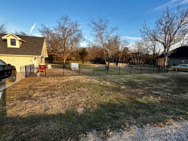 view of yard featuring a garage