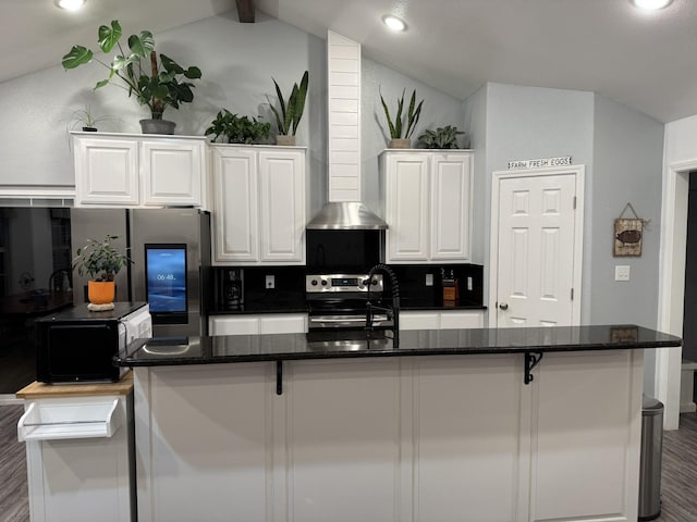 kitchen with stainless steel appliances, vaulted ceiling with beams, white cabinets, and backsplash