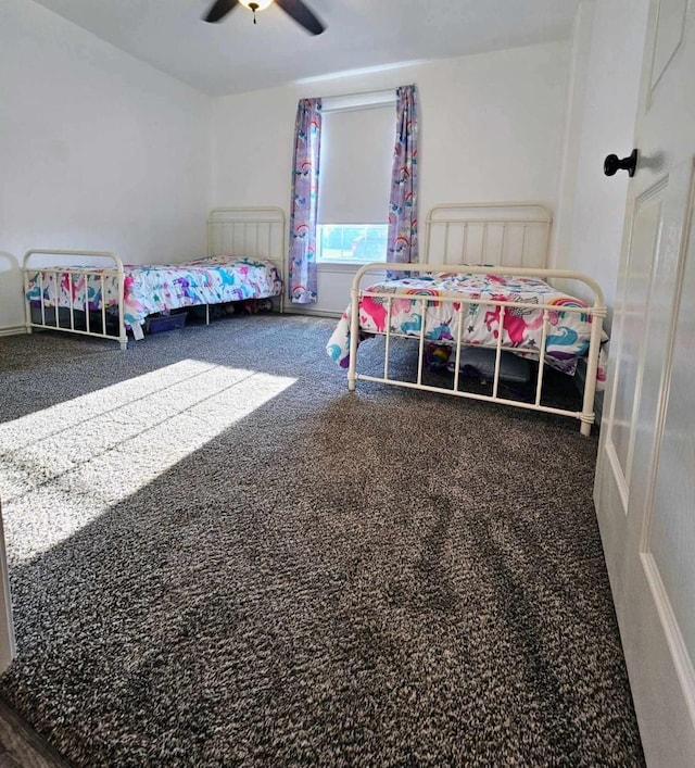 bedroom featuring ceiling fan and carpet flooring