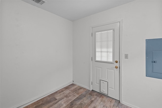 interior space with electric panel and light wood-type flooring