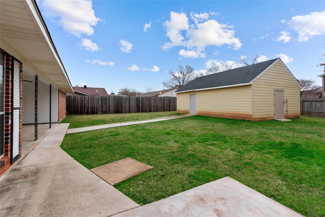 view of yard with an outdoor structure and a patio area