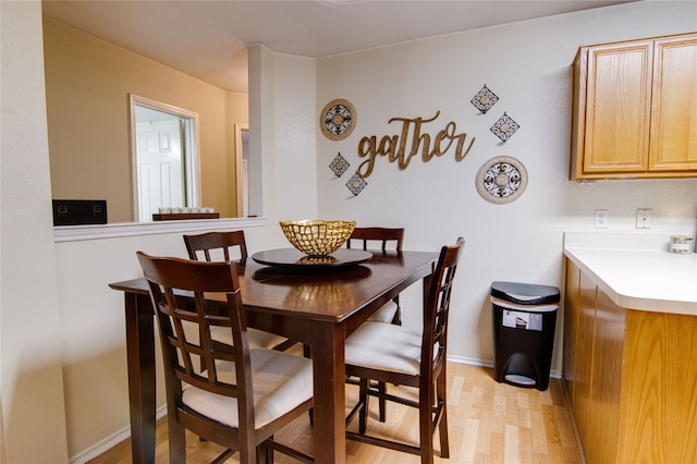 dining area featuring light wood-type flooring