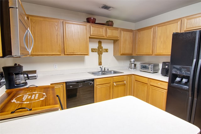 kitchen with sink and black appliances