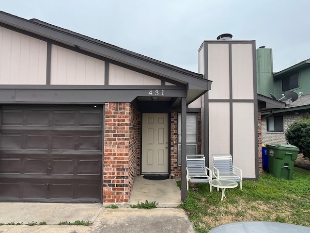 doorway to property featuring a garage