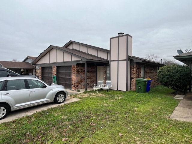 view of front of house with a garage and a front lawn