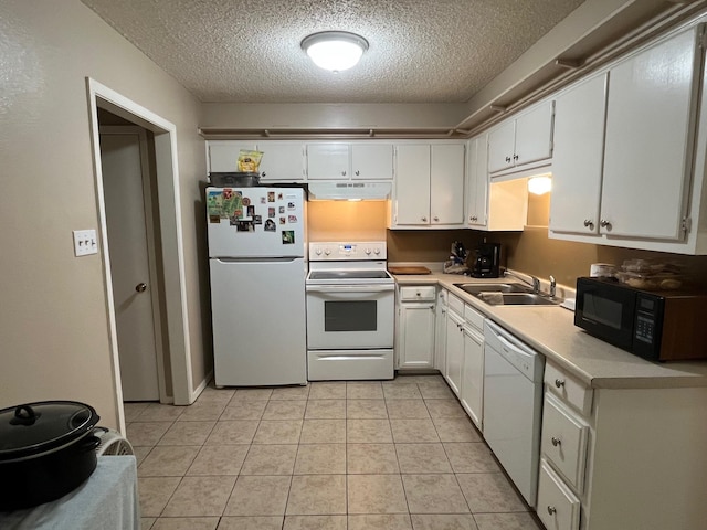 kitchen with white cabinetry, white appliances, under cabinet range hood, and a sink