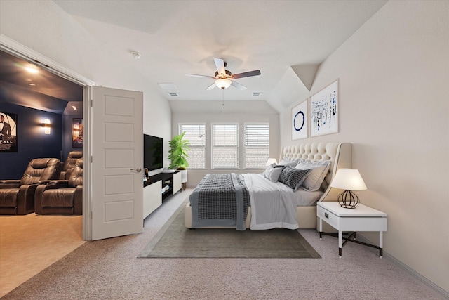 carpeted bedroom with vaulted ceiling and ceiling fan