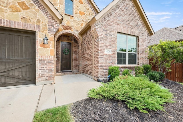 doorway to property featuring a garage