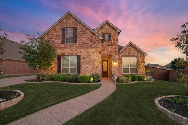 view of front of home with a yard