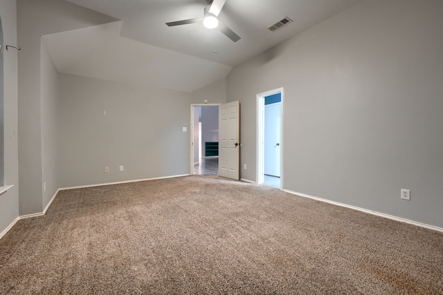 unfurnished room with vaulted ceiling, ceiling fan, and carpet