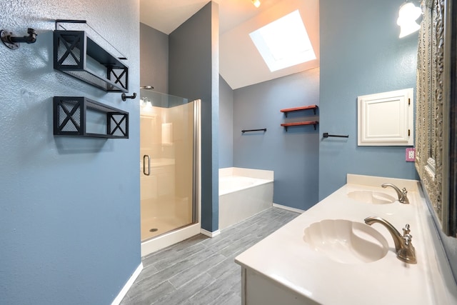 bathroom featuring vanity, shower with separate bathtub, and lofted ceiling with skylight