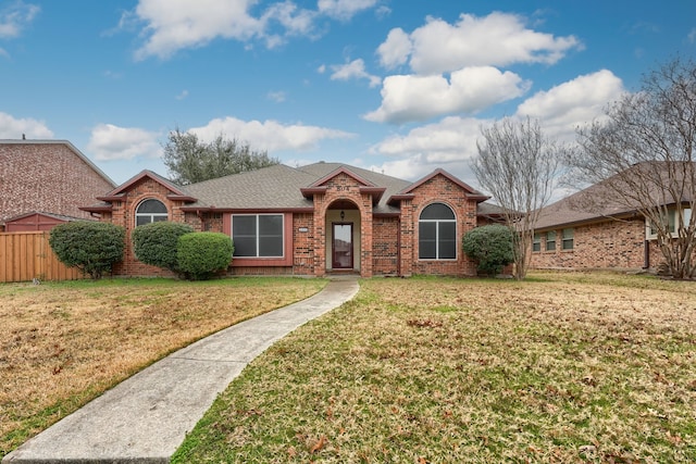 single story home with a front yard