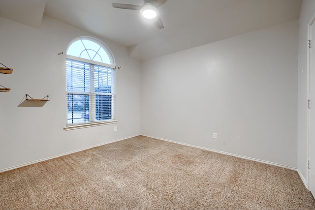 empty room with carpet floors and ceiling fan