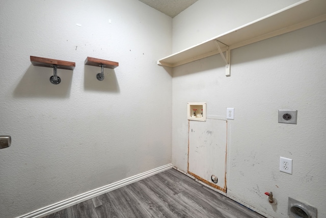 washroom with hardwood / wood-style flooring, gas dryer hookup, electric dryer hookup, and washer hookup