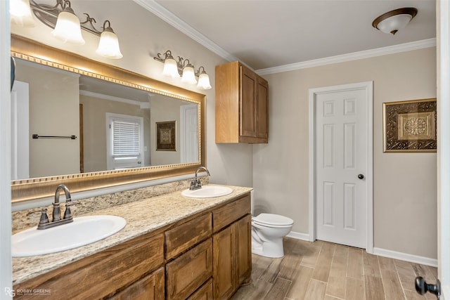 bathroom featuring crown molding, vanity, toilet, and hardwood / wood-style floors