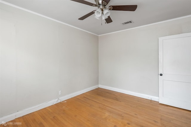 unfurnished room featuring crown molding, hardwood / wood-style floors, and ceiling fan