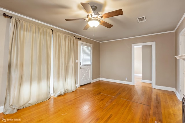 unfurnished room featuring crown molding, ceiling fan, and hardwood / wood-style flooring