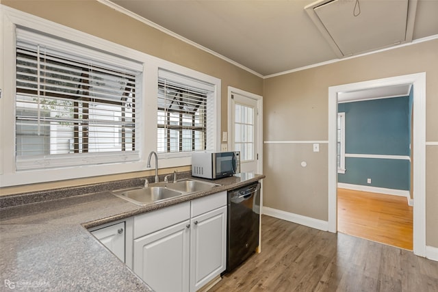 kitchen featuring dishwasher, sink, white cabinets, hardwood / wood-style flooring, and ornamental molding