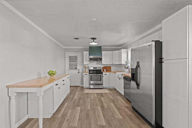 kitchen featuring sink, white cabinetry, ventilation hood, stainless steel appliances, and light hardwood / wood-style floors