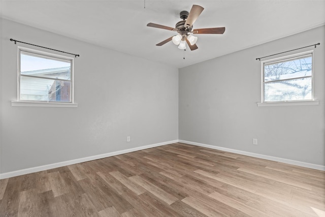 unfurnished room featuring ceiling fan and light hardwood / wood-style flooring