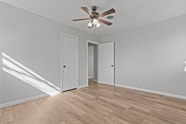 unfurnished room featuring ceiling fan and light hardwood / wood-style floors