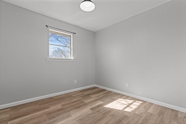 spare room featuring light hardwood / wood-style floors