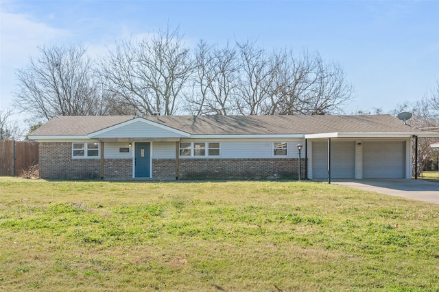 ranch-style house featuring a garage and a front lawn