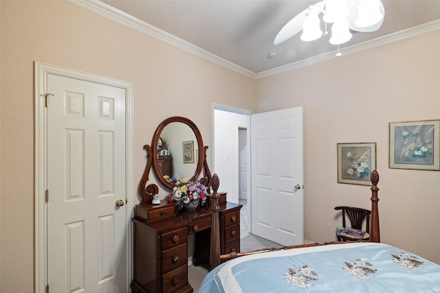 carpeted bedroom featuring ceiling fan and ornamental molding