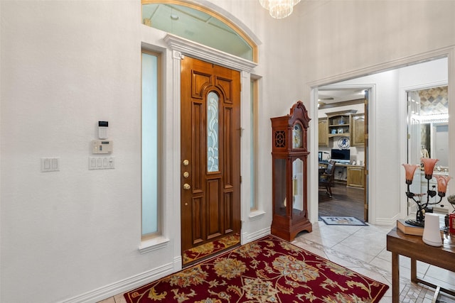 entryway with a chandelier