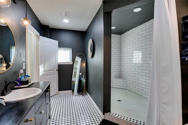 bathroom with vanity and curtained shower